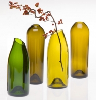 By using diamond slitting discs, files and core drills, vases and vessels can be created from old glass bottles. Vases by David Guilfoose 