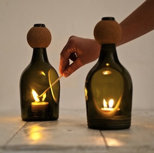 Glass Bottle Tea Light Holder by Lucirmás. By using a Diamond Slitting disc, create holes in your bottles to hold candles and tea lights in. 